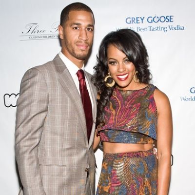 Jannero is wearing a suit and Malaysia is wearing a designer dress.